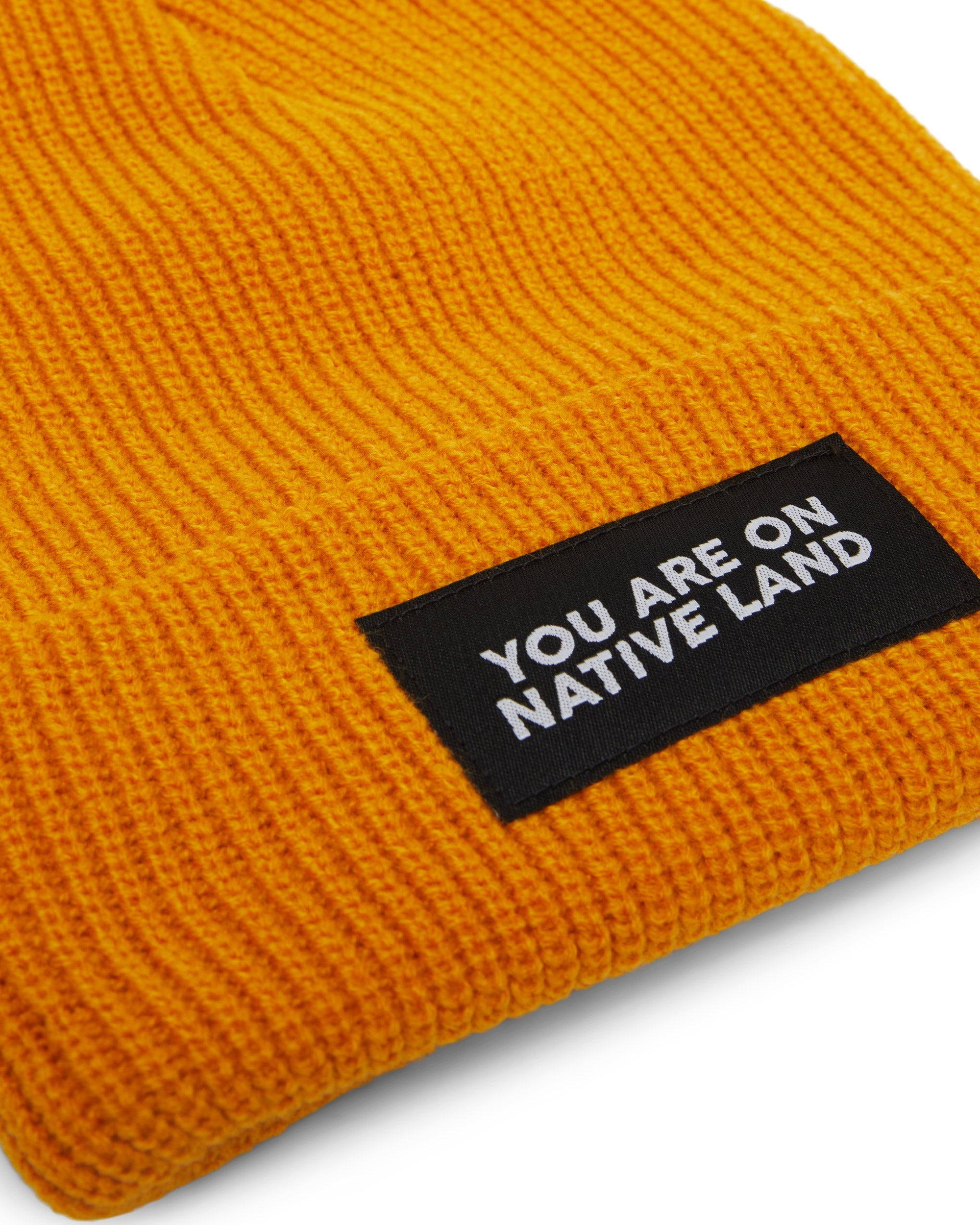 'YOU ARE ON NATIVE LAND' RIBBED BEANIE